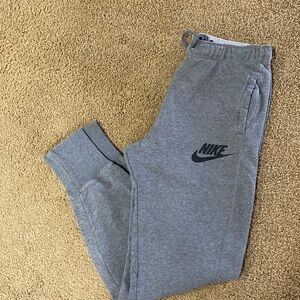 Nike sweatpants.  Elastic waist with pull string.  Cuffed ankles